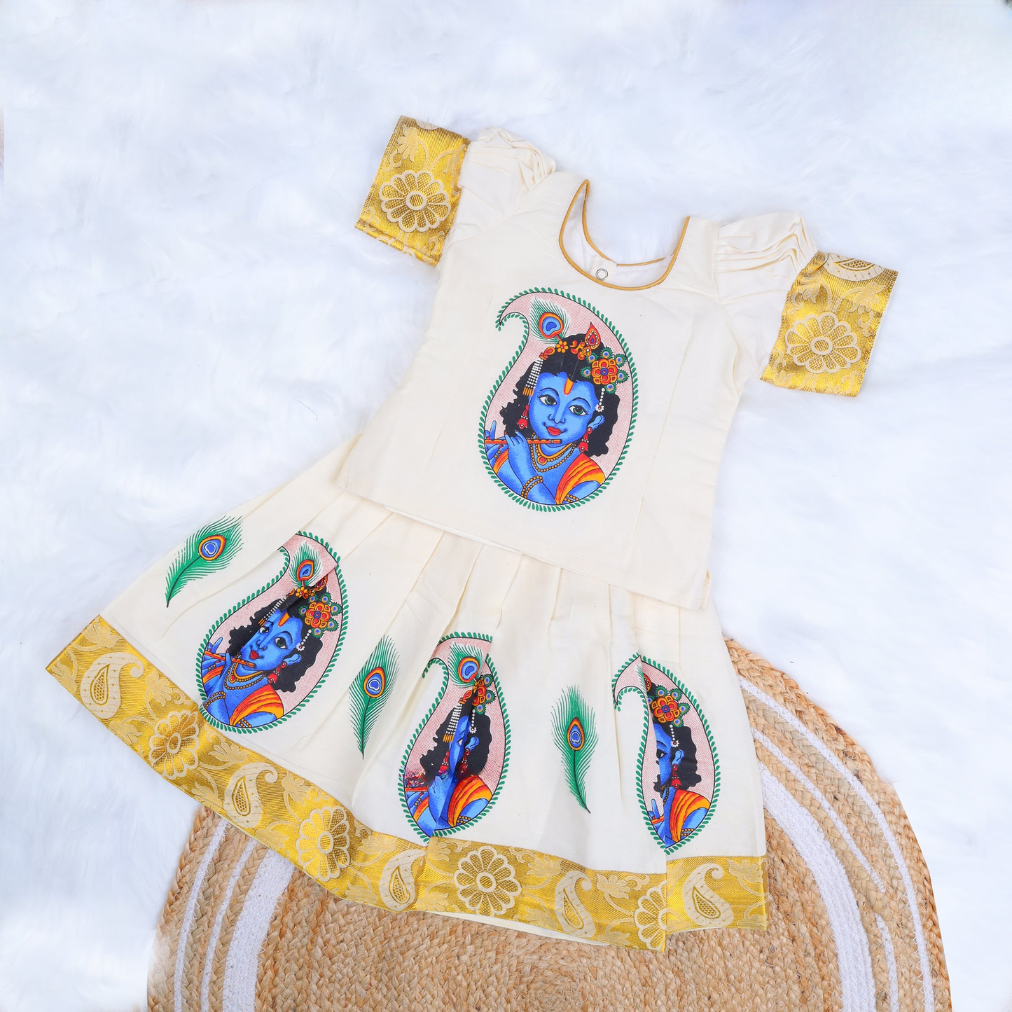 Cream Top with Krishna print and Mustard Zari Border Pattu Pavadai